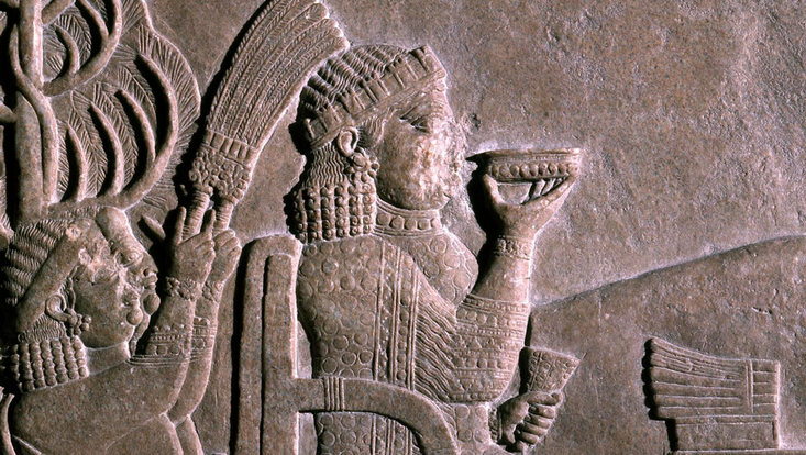 The queen drinks a cup of wine, Banquet under the vine arbour of Ashurbanipal in Nineveh (7th century BCE).